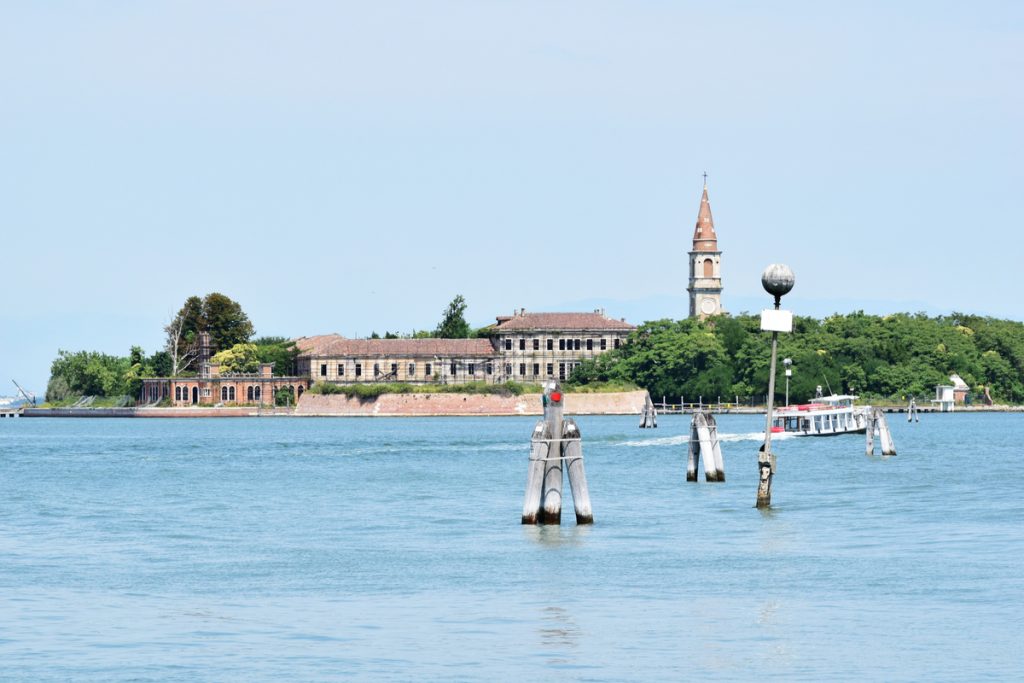Poveglia, a small island located between Venice and Lido in the Venetian Lagoon, Italy, as seen from Malamocco on Lido Island. It was used as a quarantine station in history.