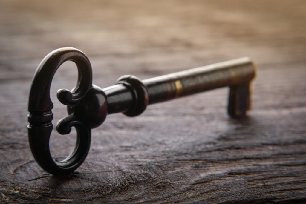 iron antique key on wood table