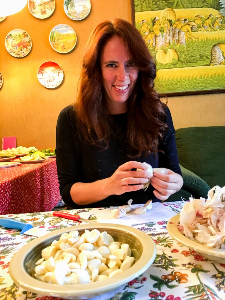 Peeling garlic to make Bagna Cauda.