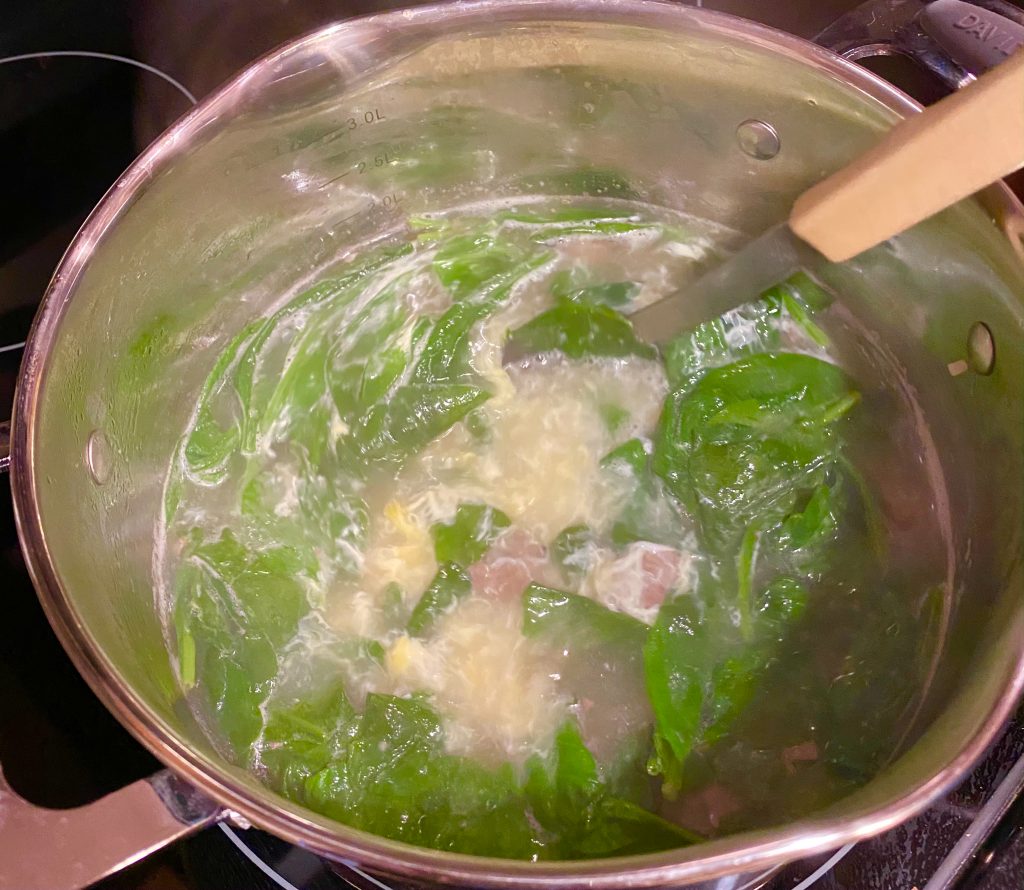 Soup with cooked spinach, meatballs
