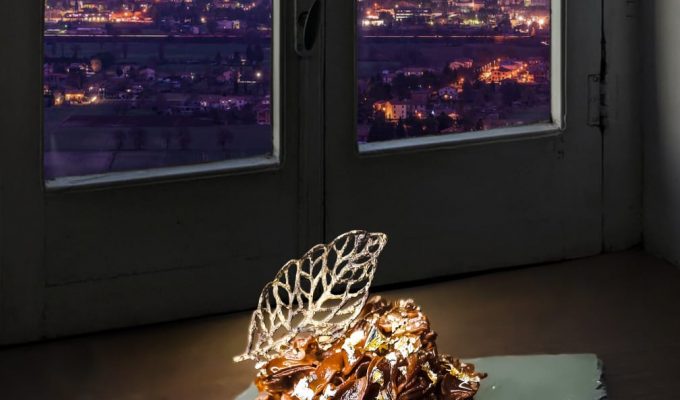 sweet dessert in front of window with christmas tree of gubbio