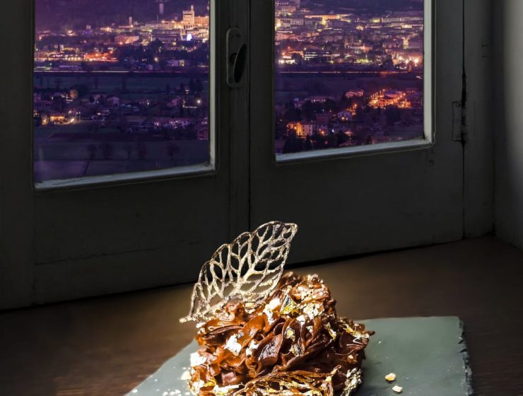 sweet dessert in front of window with christmas tree of gubbio