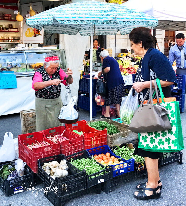 woman weighing produce