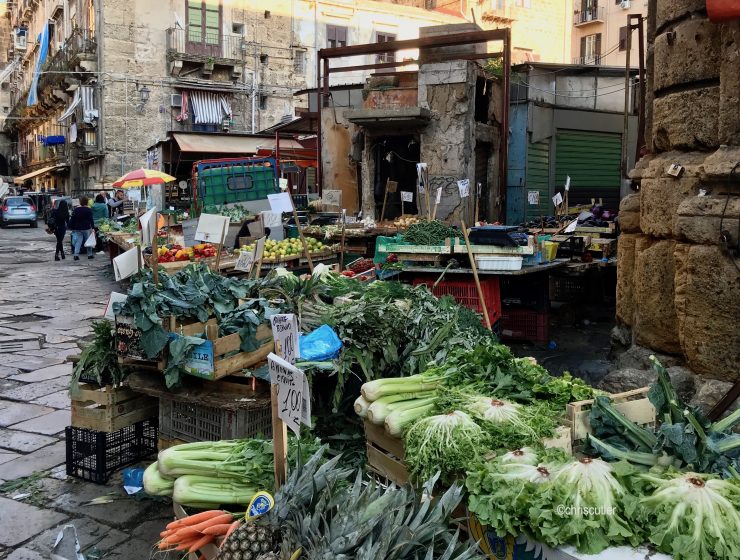 Dirty street wiith vegetables ono table