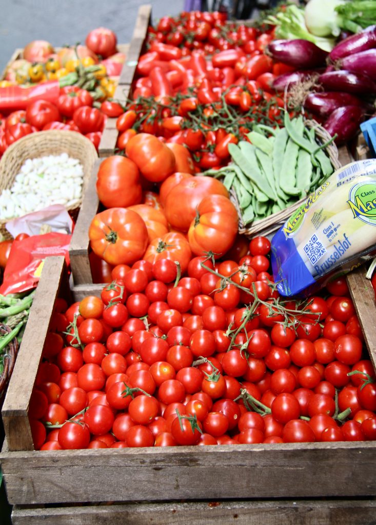 virtual vegan cooking class: fresh tomatoes found at Italian market.