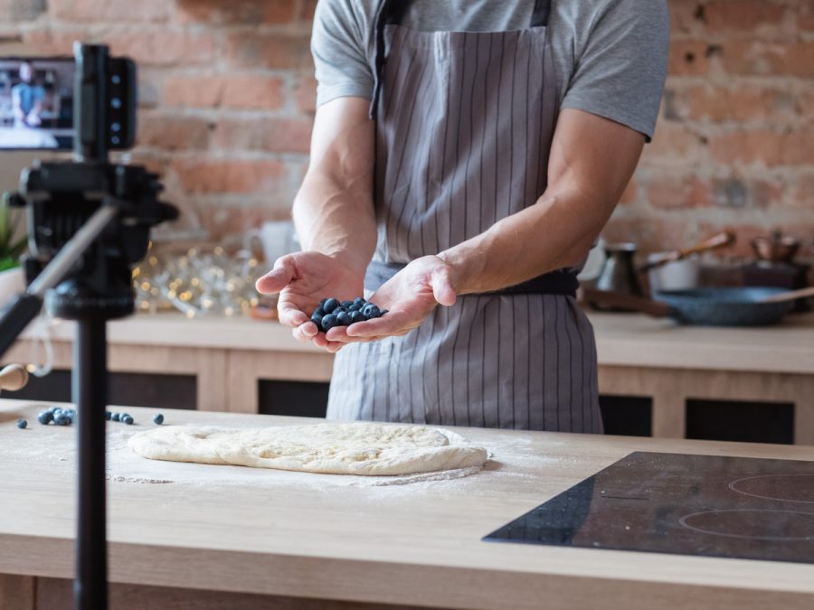 food influencers with blueberries and pastry