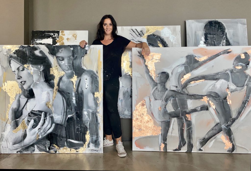 Art Basel in Miami: Italian artist Elidea stands with her paintings.