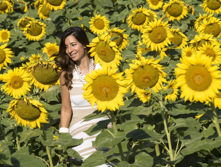 Slow living in Le Marche - woman in sunflower field Julian de Brito