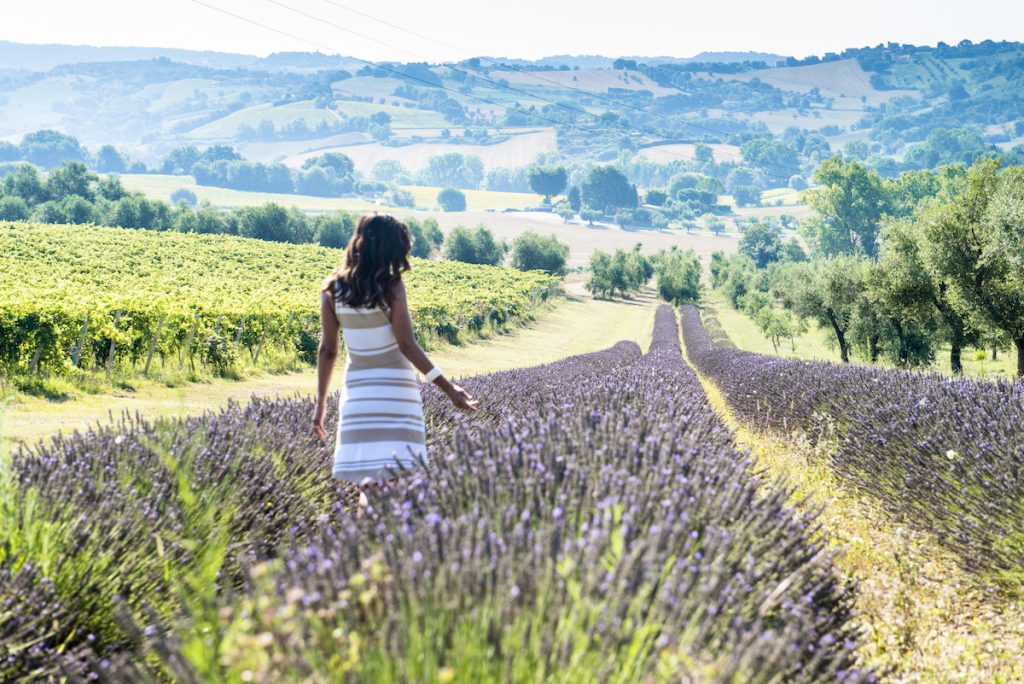 Slow living in Le Marche - woman in lavendar field in Italy. Wonderful Marche