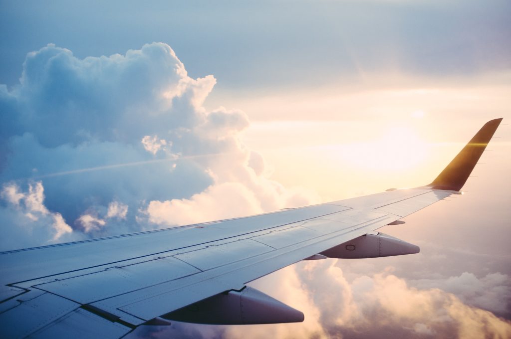 Summer travel to Italy: airplane wing