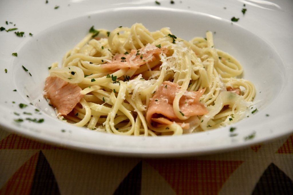 linguini pasta dish with smoked salmon and onions