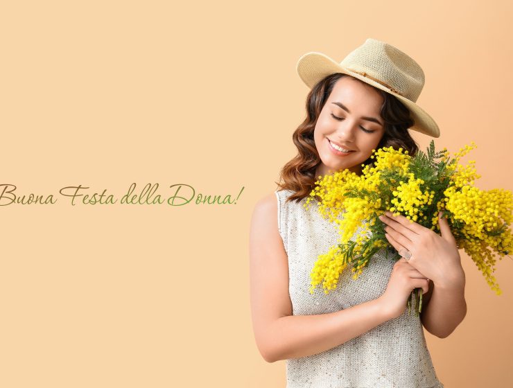 Festa della Donna - young woman with Mimosa flowers