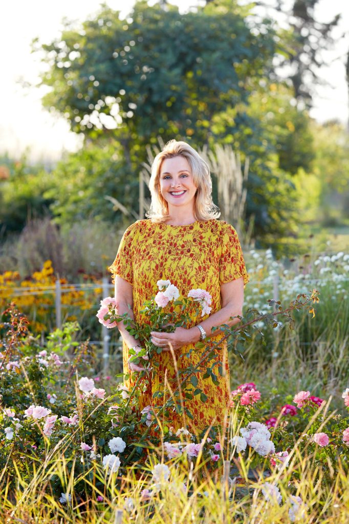 Debbie taking a stroll in her lovely flower garden, © Stacey Van Berkel