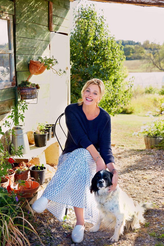 Debbie relaxing with a furry friend, © Stacey Van Berkel