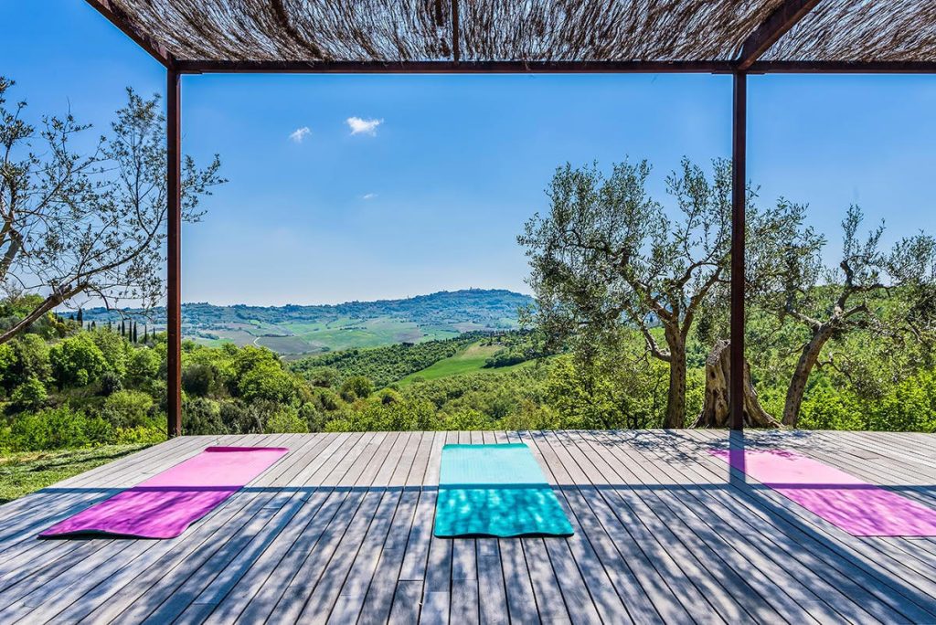 Yoga with a view of the Val d'Orcia, © Stacey Van Berkel