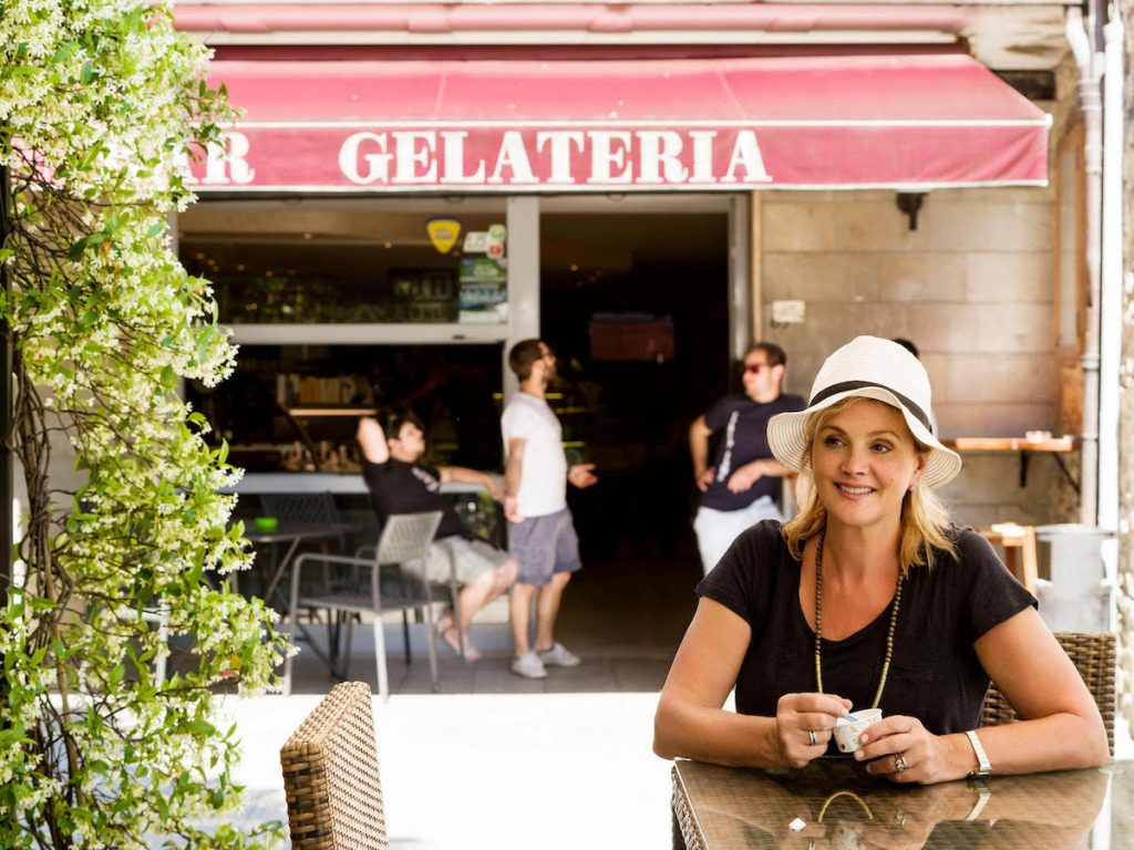 Debbie enjoying village life with some  gelato, © Stacey Van Berkel