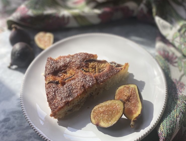 fig and almond cake and fresh figs on white plate