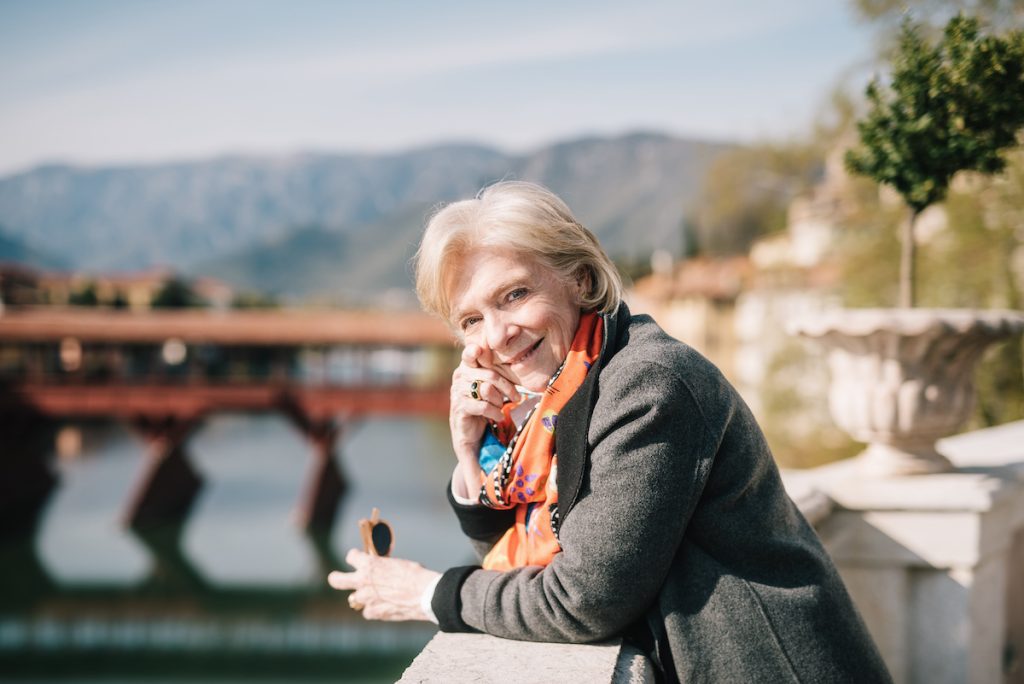 Susan Gravely with northern Italy scenery in the background