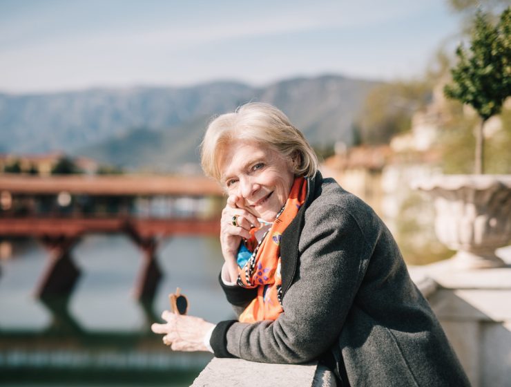 Susan Gravely with northern Italy scenery in the background