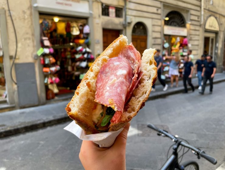 eat in florence - hand holding panino on florence street