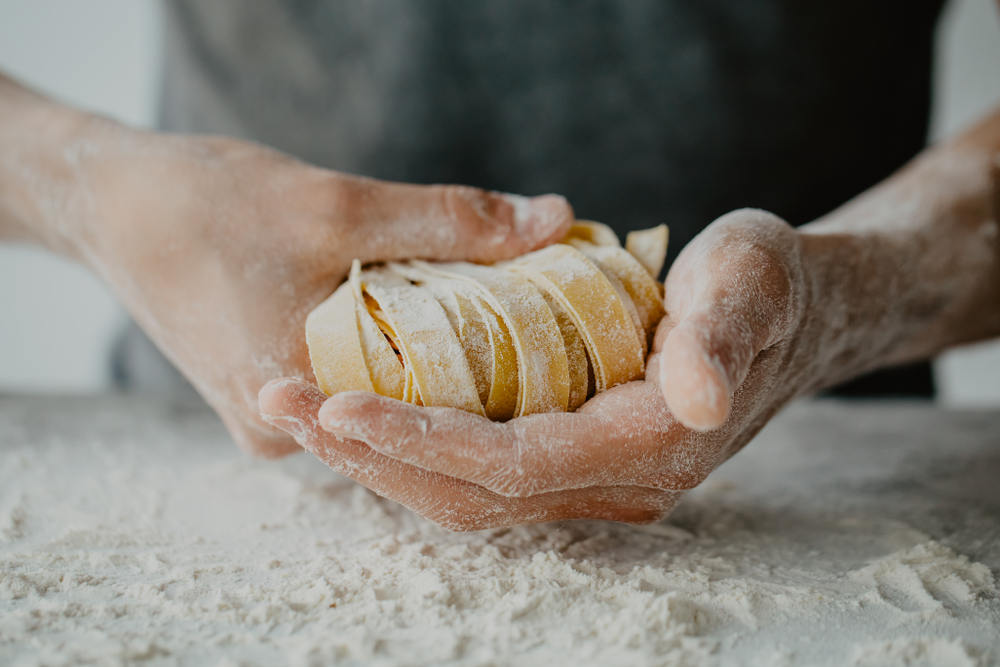 Italian stereotypes : man making pasta close-up