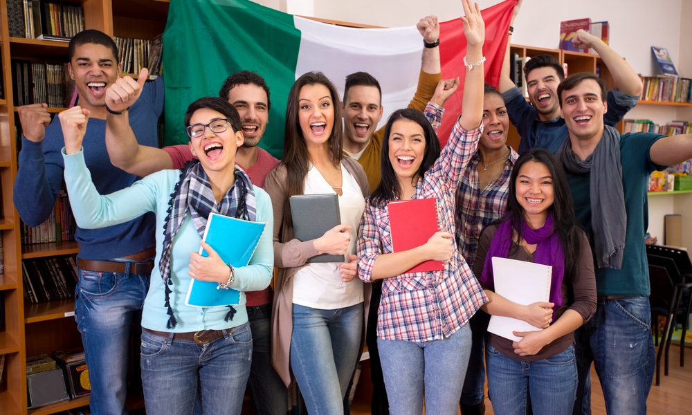 multicultural students in library with Italian flag