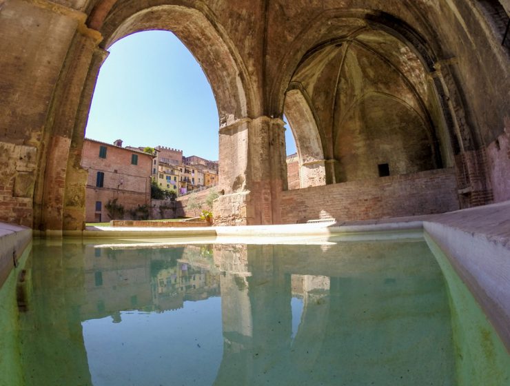Water pool inside ancient Fontebranda fountains in Siena, Italy