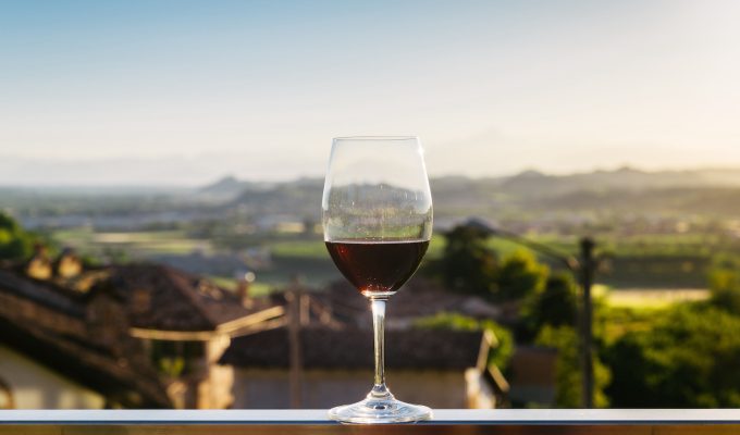 glass of red wine overlooking Piemonte
