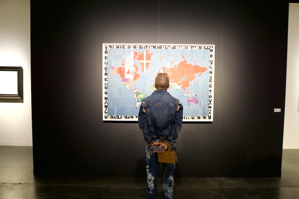 man looking at art - map Art Basel Miami Beach 2024