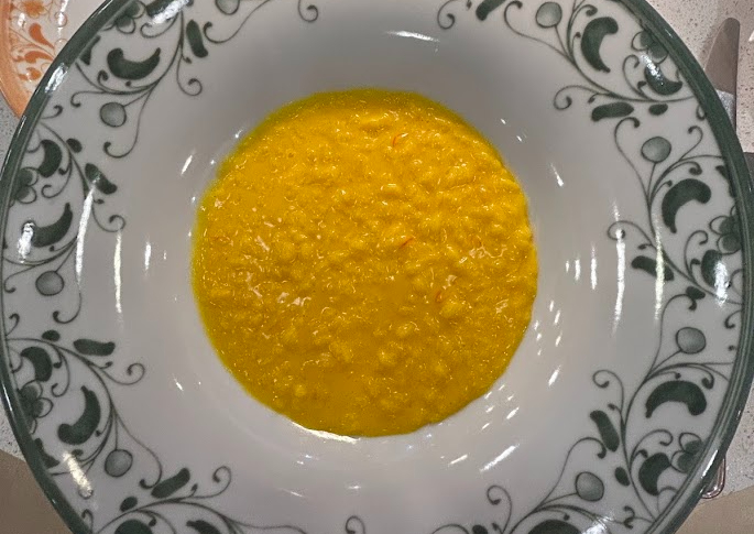 Vibrantly colored Risotto alla Milanese dish at Eataly Milano Smeraldo.