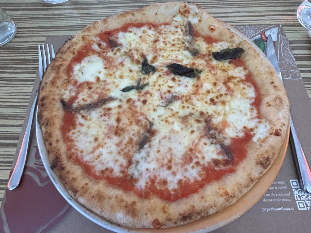 Authentic Neapolitan gluten-free pizza at O' Peperino e Milano, a top dining spot for celiacs deciding where to stay in Milan.