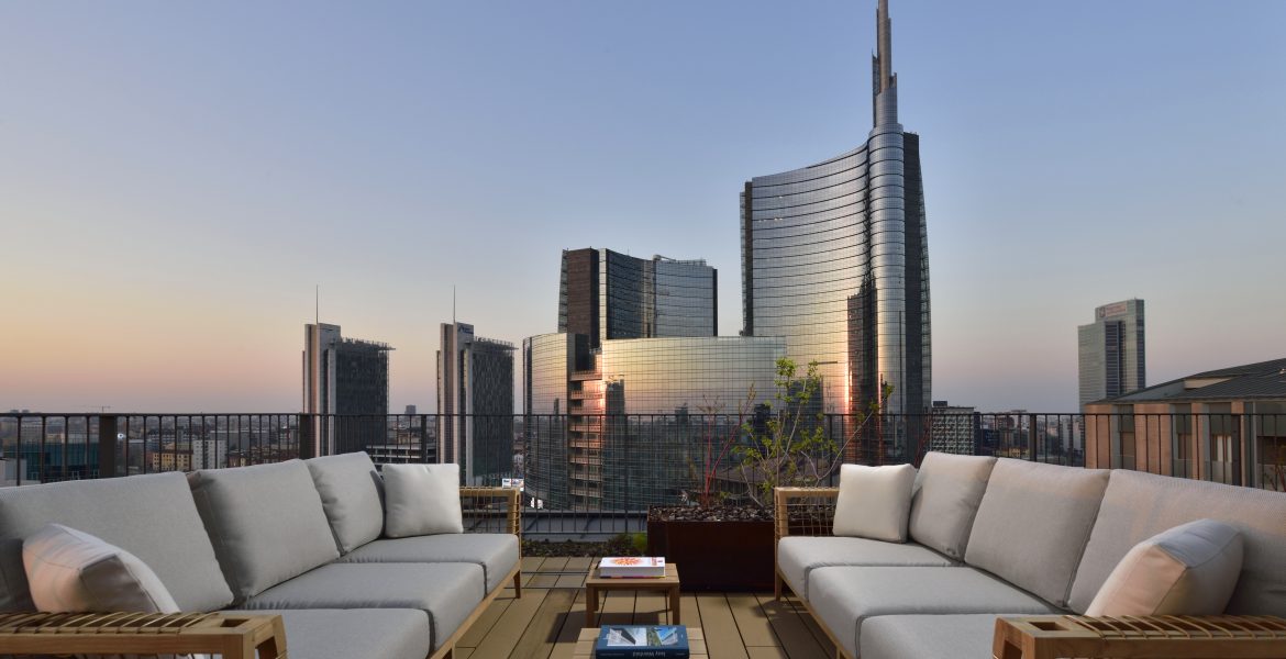 Stunning Milan sunset skyline view from Milano Verticale rooftop, a beautiful sight for those deciding where to stay in Milan.