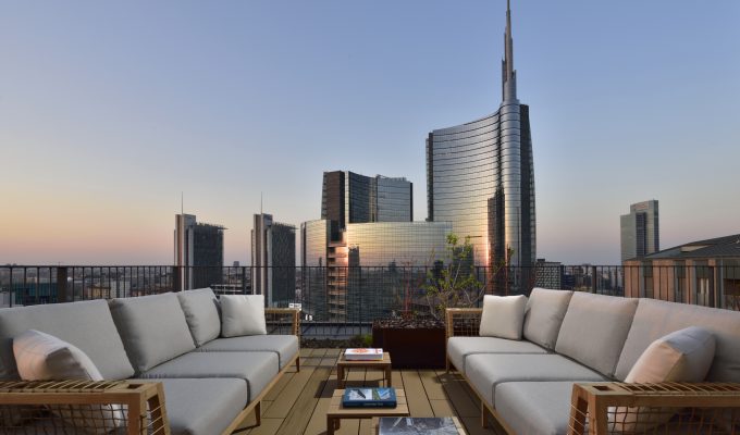 Stunning Milan sunset skyline view from Milano Verticale rooftop, a beautiful sight for those deciding where to stay in Milan.