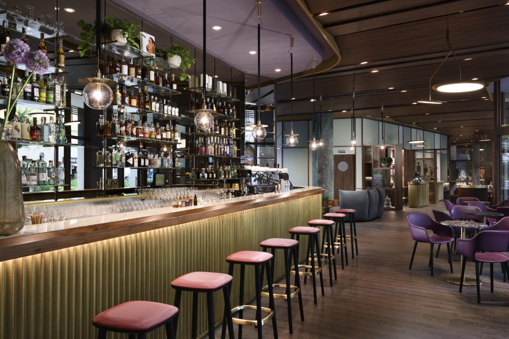 Sophisticated bar at Milano Verticale | UNA Esperienze hotel, a key amenity for where to stay in Milan.