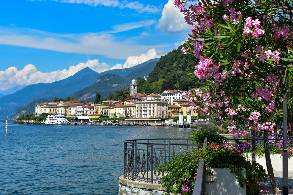A scenic view of Lake Como, showcasing its lush landscape and luxurious ambience, a top choice for day trips from Milan.