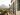 moving to Italy - young couple on balcony overlooking Italy landscape