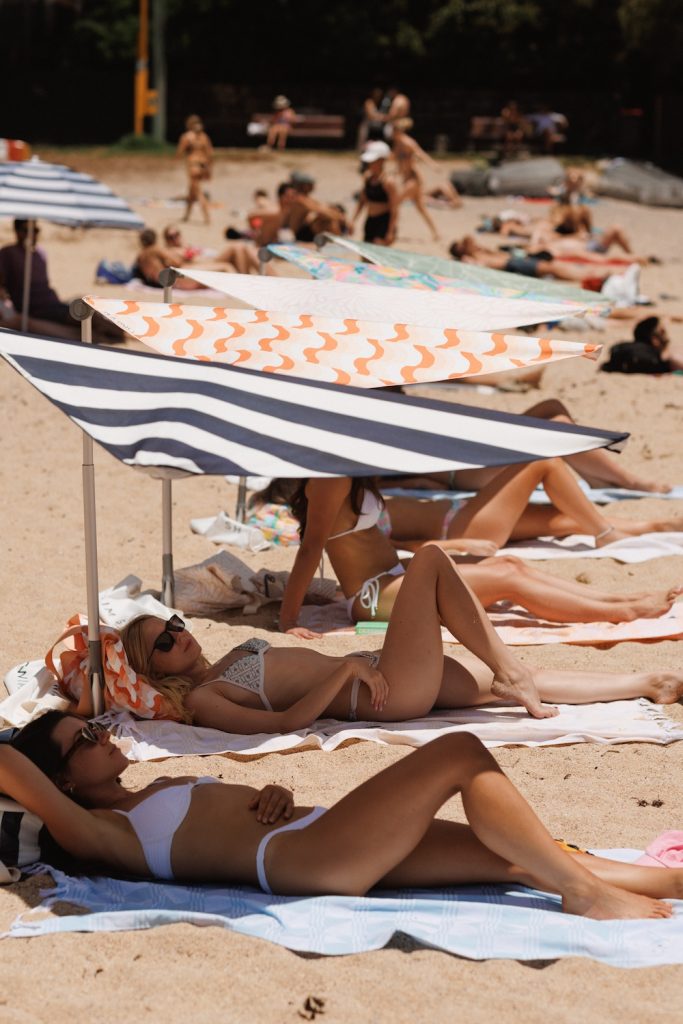 Swim Shady beach umbrellas, beachgoers Australia | Holiday Gift Guide Inspired by Italy
