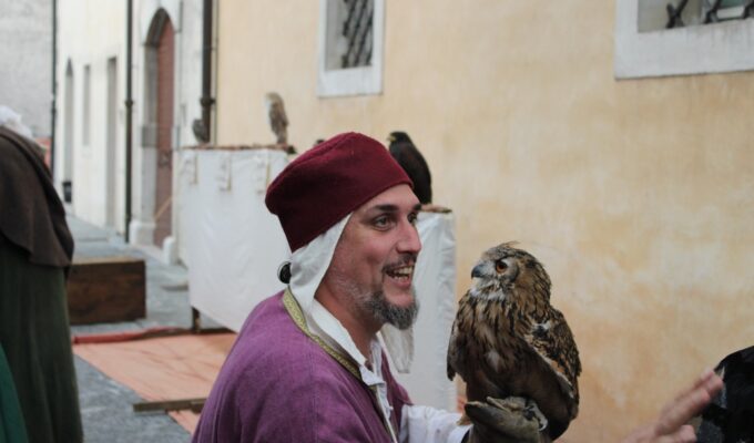 Fall festival Venzone man holding owl