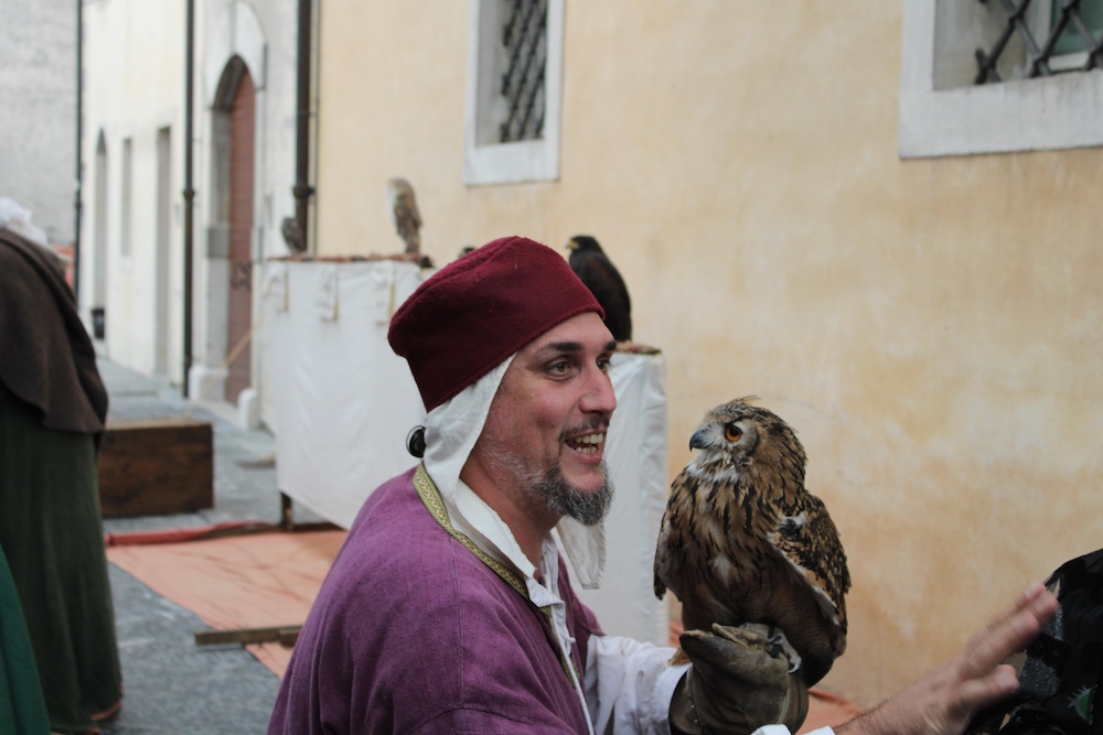 Fall festival Venzone man holding owl