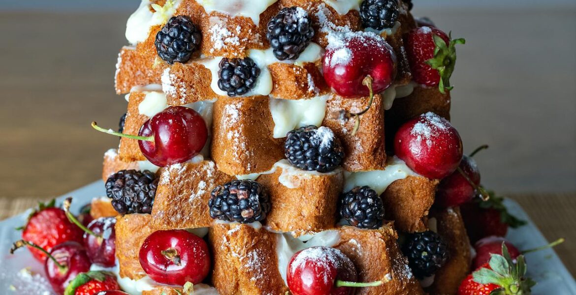 Pandoro Christmas tree dessert for easy Italian holiday entertaining with whipped cream and berries.
