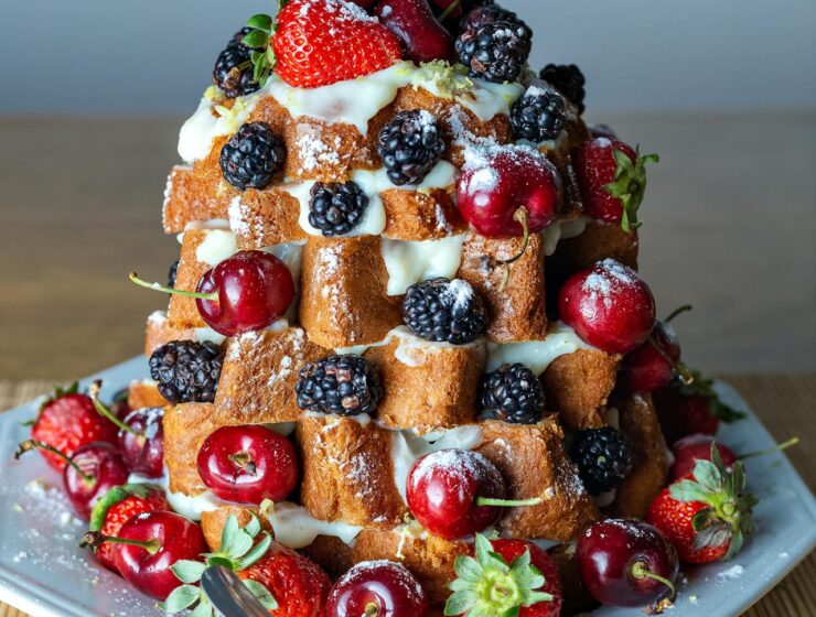 Pandoro Christmas tree dessert for easy Italian holiday entertaining with whipped cream and berries.