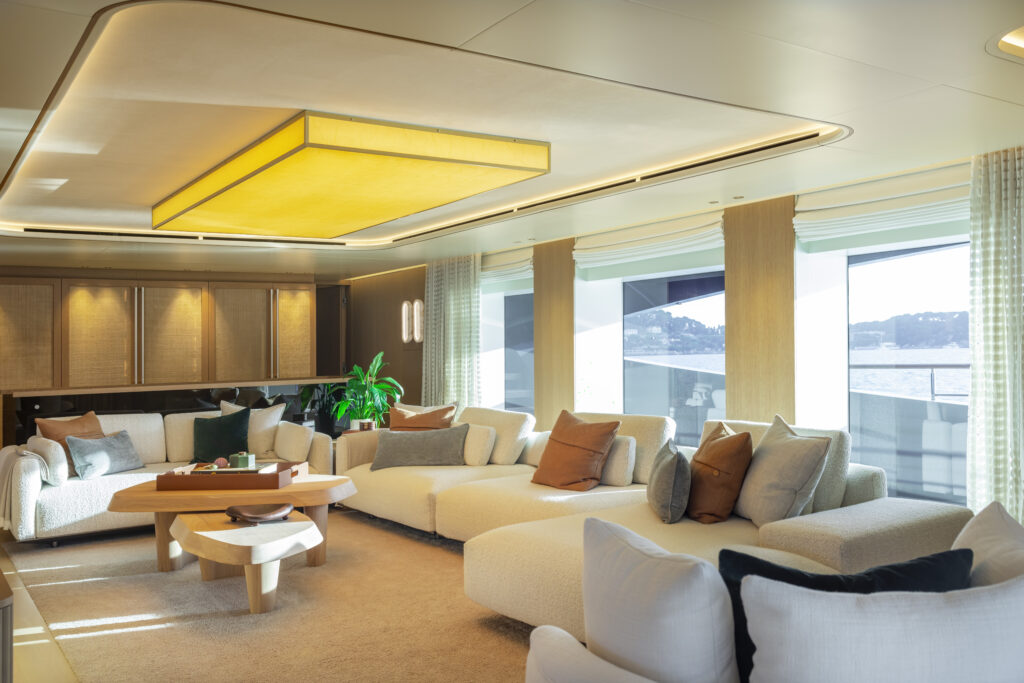 Interior lounge of the Rossinavi Seawolf X yacht featuring plush sofas and refined finishes