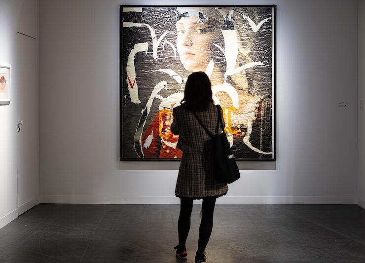 woman looking at large painting at Art Basel Miami Beach