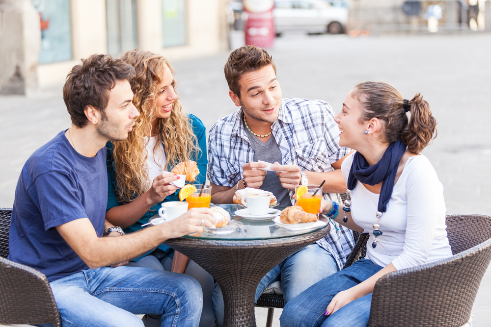 Group of Friends Having a Traditional Italian Breakfast