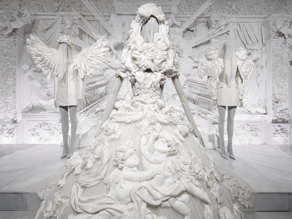 White Baroque-inspired Dolce & Gabbana Alta Moda gowns displayed at ICA Miami, showcasing sculptural fashion influenced by Sicilian Baroque art and architecture.