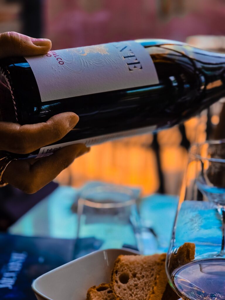 Pouring Montefalco wine during a tasting experience at Mevante Umbria