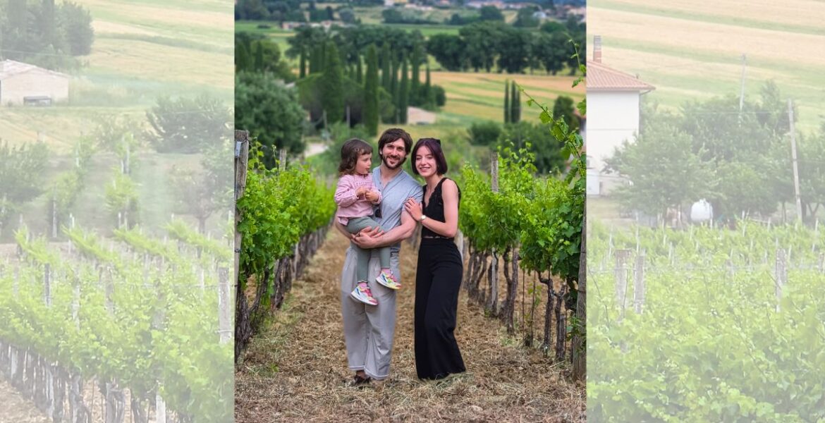 Guests in the vineyards of Mevante overlooking the Umbrian countryside near Bevagna