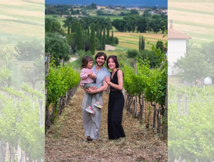 Guests in the vineyards of Mevante overlooking the Umbrian countryside near Bevagna