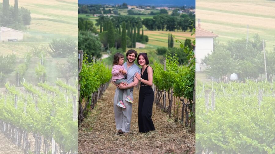 Guests in the vineyards of Mevante overlooking the Umbrian countryside near Bevagna