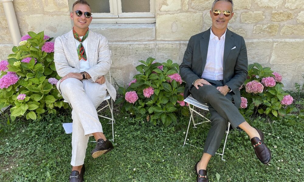 Dustin and Luigi outside their home in an Abruzzo village after relocating from Canada to Italy